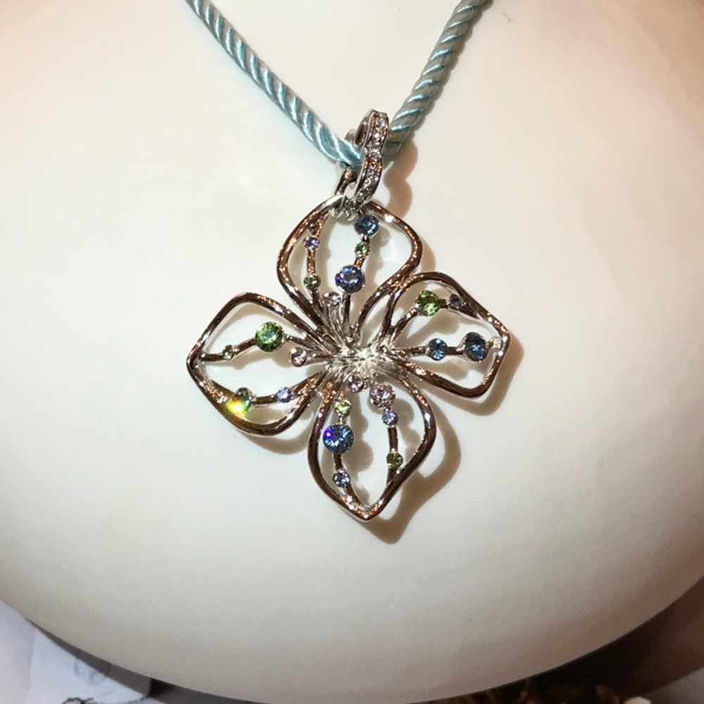Necklace with flower light blue rope. New, no tag.